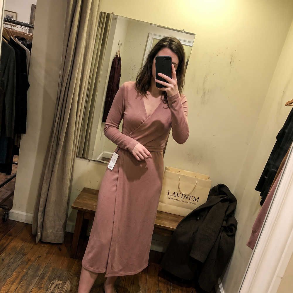Customer photo: dusty pink wrap midi dress in a fitting room with a Lavinem shopping bag